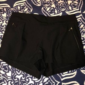 Soft, good material black shorts with gold zippers